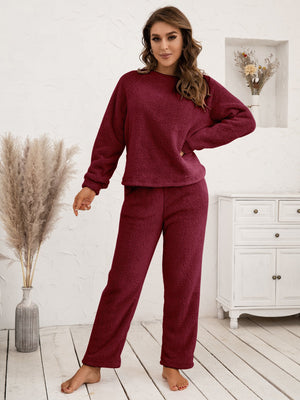Plush loungewear set in burgundy with raglan sleeves and relaxed fit pants.