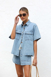Light wash denim short sleeve button-up shirt and drawstring shorts set with chest pockets.