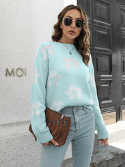 Pastel blue acrylic knit crewneck sweater with a white floral pattern.