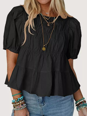 Black maternity blouse with puff sleeves, ruffled tiers, and ruched bodice.