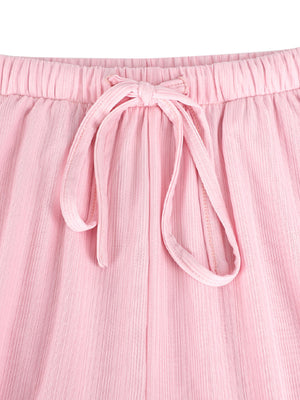 Pink crinkled wide leg pants with elastic waist and drawstring tie detail