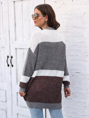Colorblock knit open cardigan with white, gray, and brown stripes.