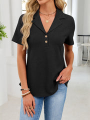Black waffle knit polo shirt with button placket and collared neckline.
