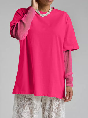 Hot pink oversized tee with sheer long sleeves and a crew neck.