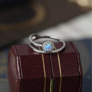 Iridescent opal halo ring with double band in 925 sterling silver.