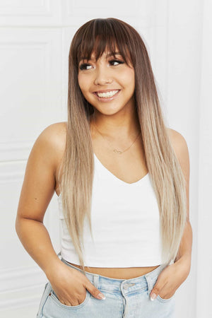 Ombre fringe synthetic hair extension in black to gray, styled with bangs and straight, long hair.