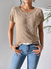 Camel knit pocket tee with textured check pattern and crew neck.