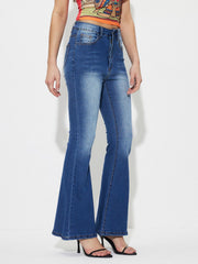 Mid-rise flared denim jeans in medium wash cotton with a buttoned closure.