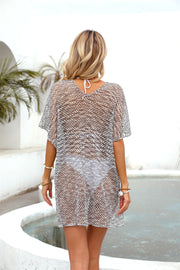 Gray metallic knit batwing cover-up with V-neck and short sleeves.
