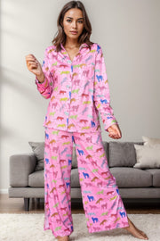 Pink leopard print pajama set with long sleeves and wide-leg pants.