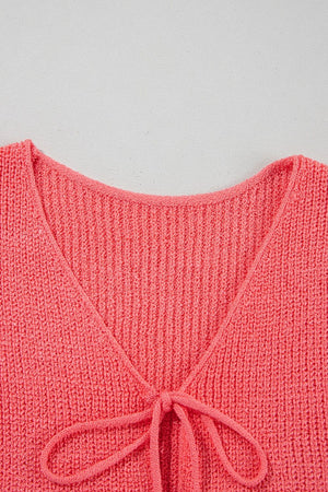 Burnt Coral textured knit tank top with tie-front detail and V-neckline.