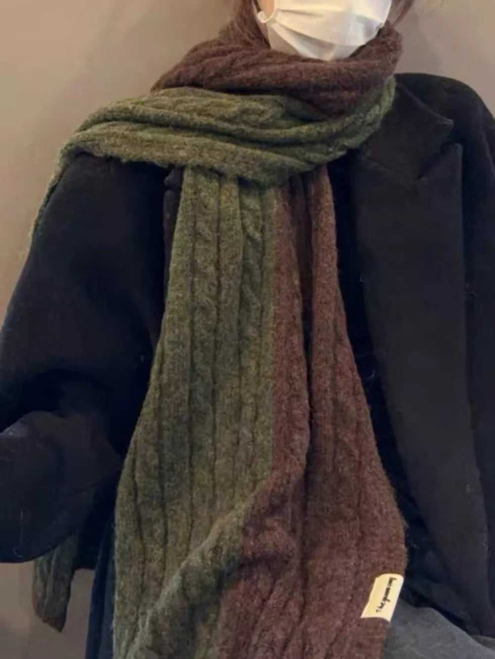 Textured two-tone wool blend scarf in green and brown cable knit.