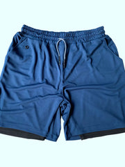 Blue dual-layered performance shorts with drawstring waist and phone pocket detail.