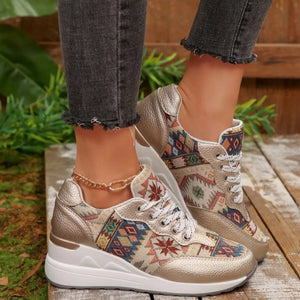 Gold wedge sneakers with geometric pattern and chunky sole