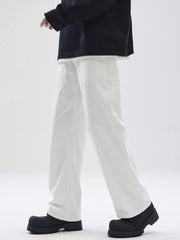 Relaxed fit white cotton chinos with square front pockets.