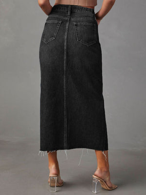 Dark wash denim midi skirt with raw hem and back pockets.