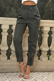 Gathered waistline tapered trousers in matcha green with button detail and cropped length.