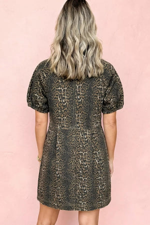 Denim dress with leopard print, puff sleeves, and a cinched waist.