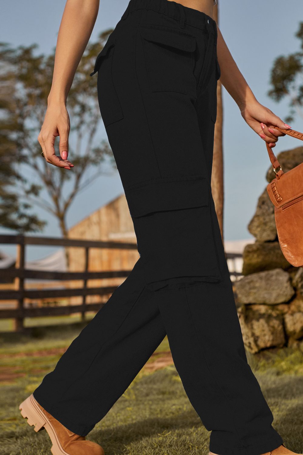 Black utility pocket denim cargo pants with a relaxed fit.