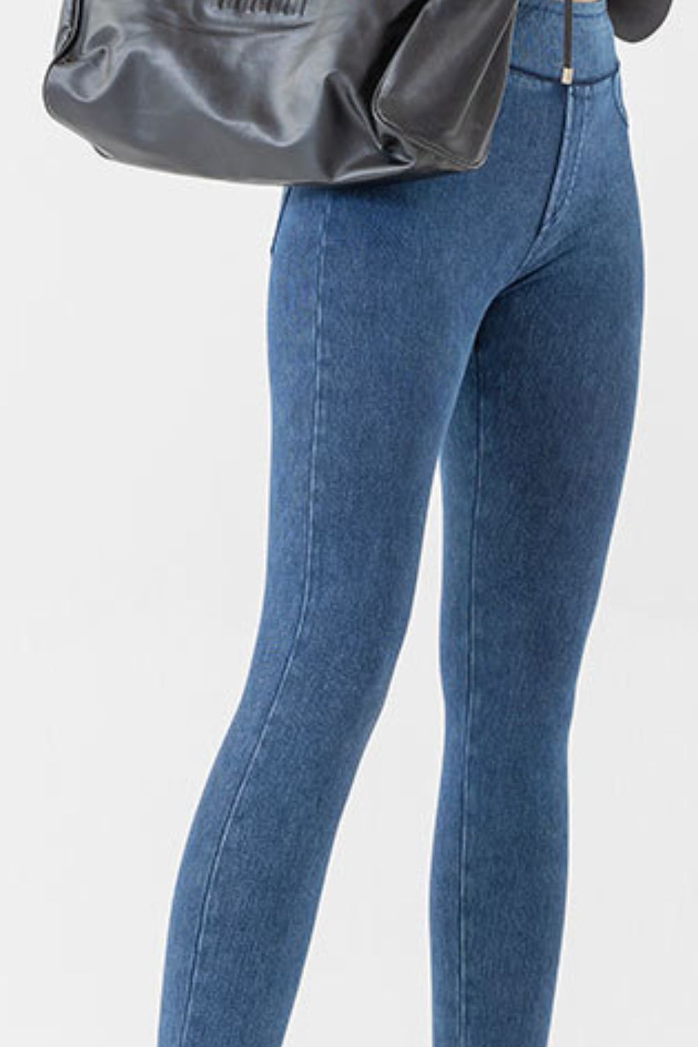Sculpted denim-effect leggings in medium blue with a high waist and front seam detail.