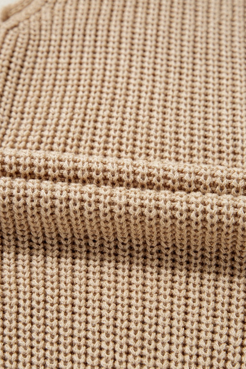 Tan knit tank top with a textured waffle stitch pattern.