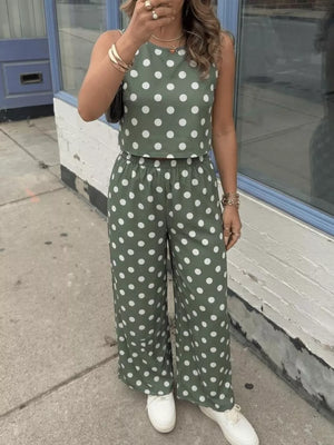 Green polka dot crop top and wide-leg pants set with a round neckline and sleeveless design.