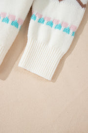 White acrylic knit sweater with pastel geometric pattern and ribbed cuffs.