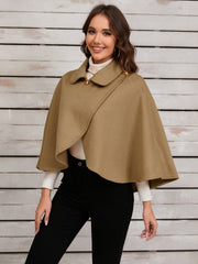 Camel asymmetric button-front cape jacket with a collar and gold button details.