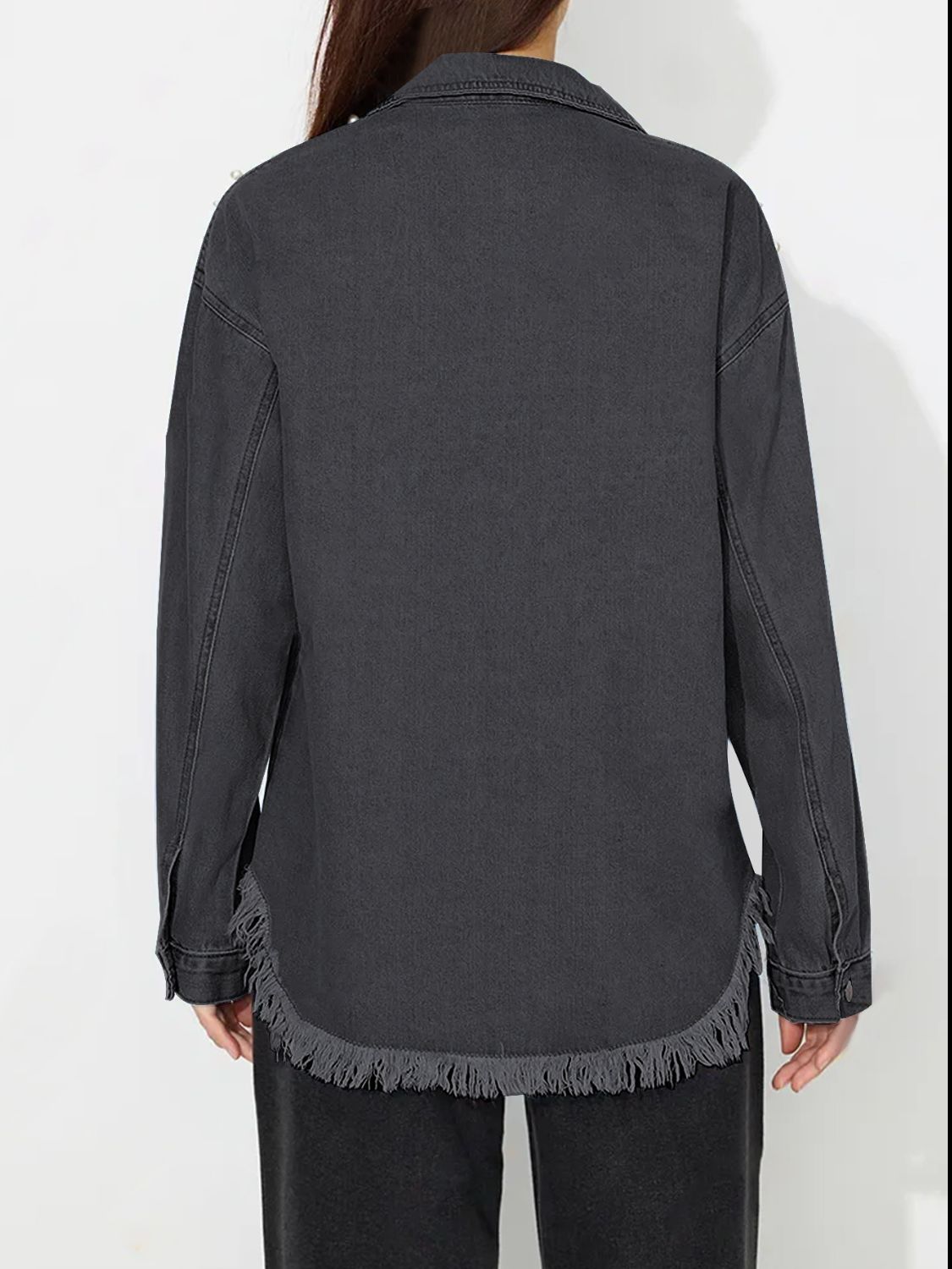 Dark wash denim shirt with frayed hem and pearl embellishments.
