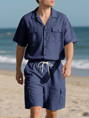 Navy blue button-up shirt and drawstring shorts set with cargo pockets.