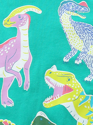 Kids' cotton t-shirt with playful dinosaur graphics in purple, yellow, blue, and pink on a teal background.