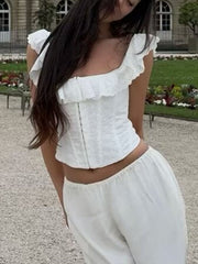 White eyelet corset tank top with ruffled trim and square neckline