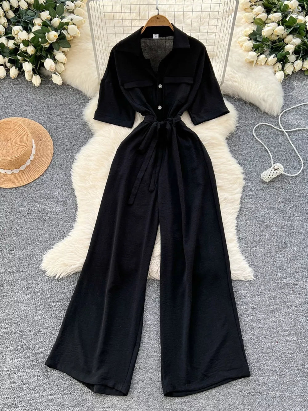 Black belted wide-leg maternity jumpsuit with pockets and button front