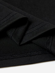 Black relaxed fit t-shirt detail showing hem and seam stitching