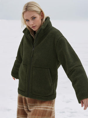 Olive green sherpa jacket with stand collar and zip front, featuring two front pockets.
