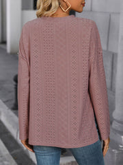 Dusty pink perforated henley shirt with slit hem and long sleeves.