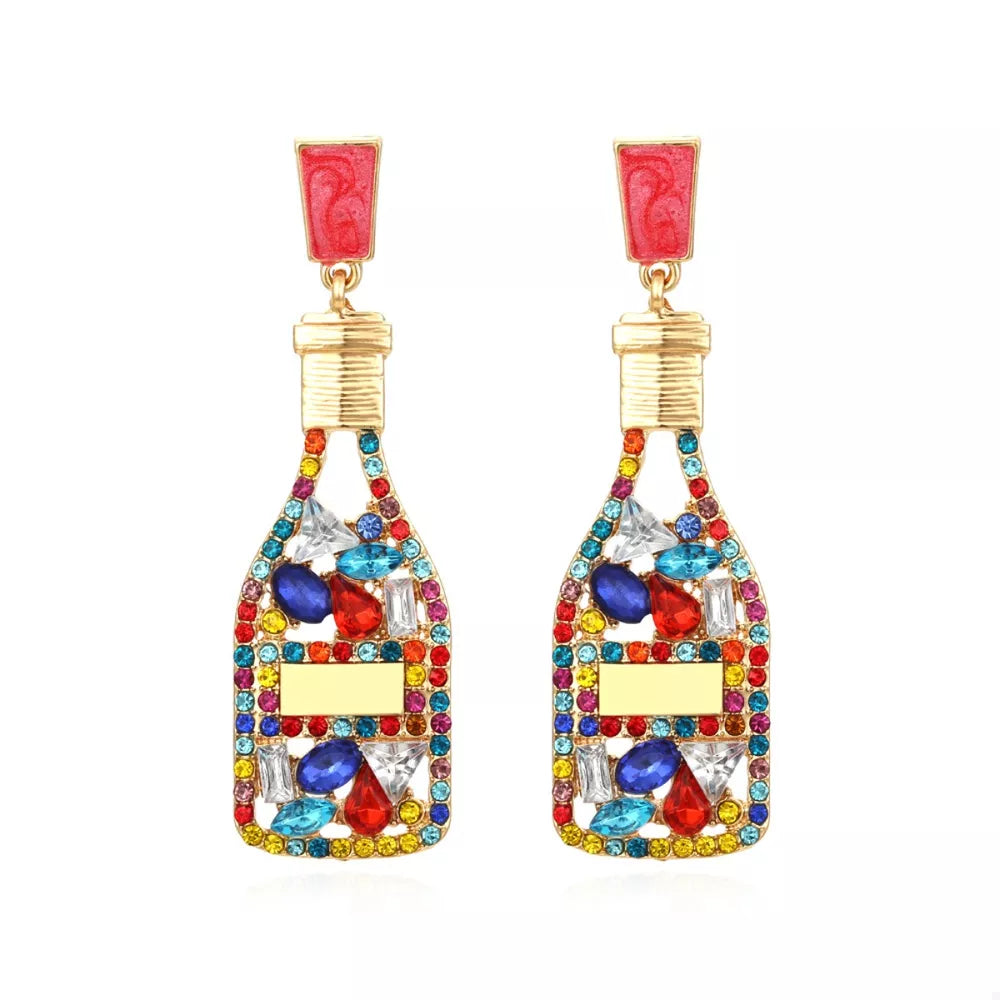 Color mixing champagne bottle drop earrings with colorful rhinestones and red tops.