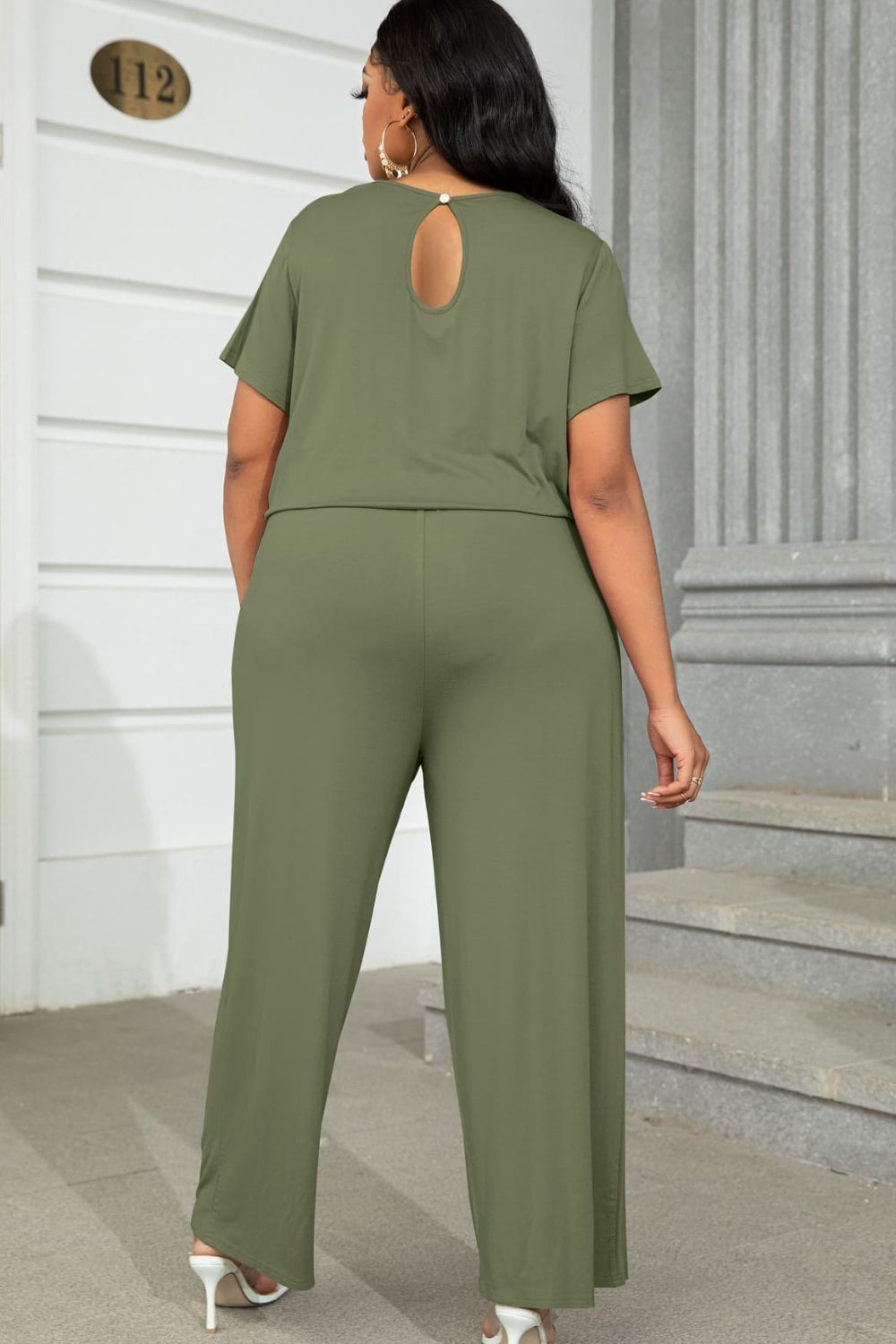 Moss relaxed fit jumpsuit with short sleeves and keyhole back detail.