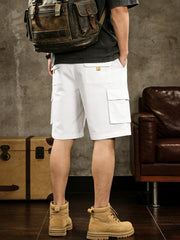 White cargo shorts with multiple pockets and drawstring comfort detail.