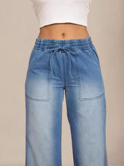 Light blue denim maternity jeans with drawstring waist and wide leg