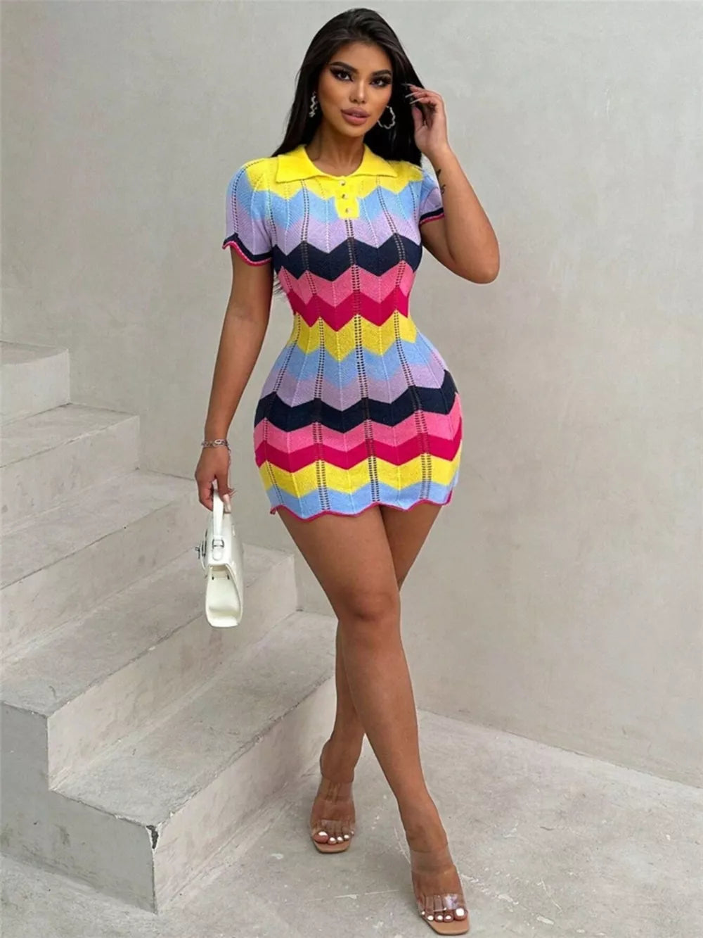 Zigzag knit short sleeve sweater dress in yellow and multicolor chevron pattern.