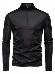 Black performance zip-neck tee with structured shoulders and long sleeves.
