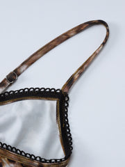 Lace trim cami set with leopard print and adjustable straps.