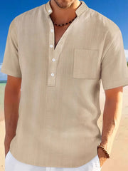 Khaki textured linen henley shirt with mandarin collar and chest pocket.