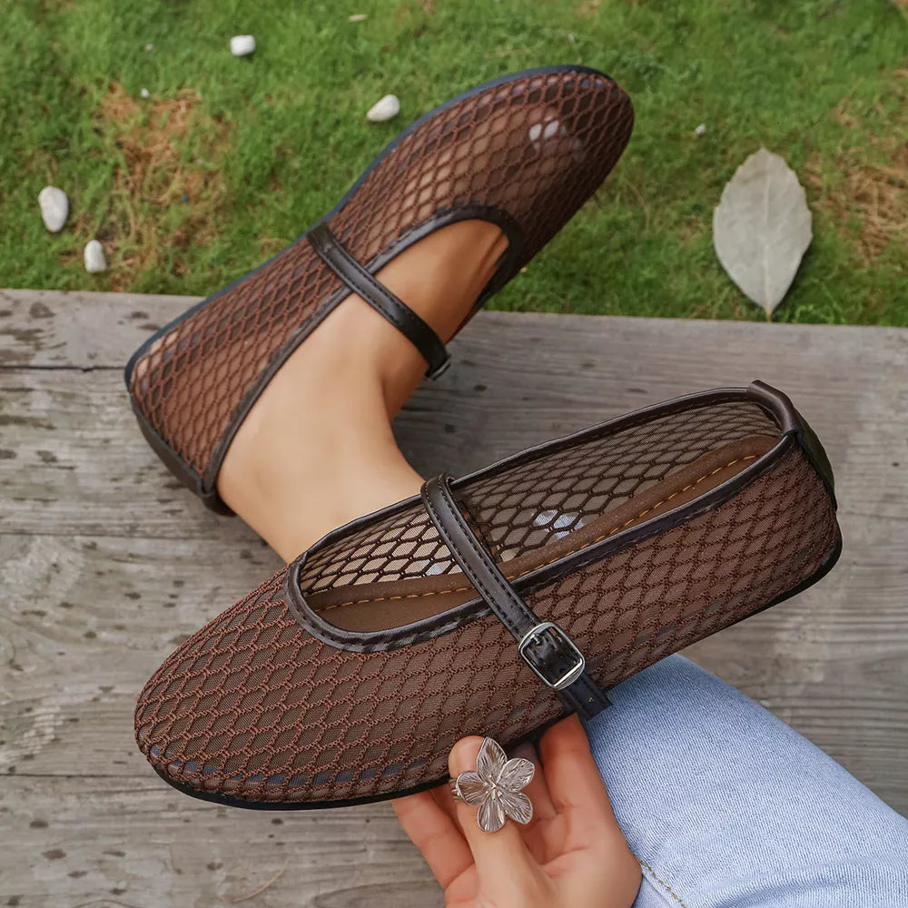 Brown mesh Mary Jane flats with buckle strap and dark trim.