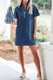 Denim collared mini shift dress with zip front and patch pockets.