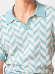 Chevron knit polo with V-neck collar in pastel blue and white, short sleeves.