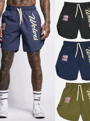 Navy active drawstring shorts with Wolves script logo and flag patch.