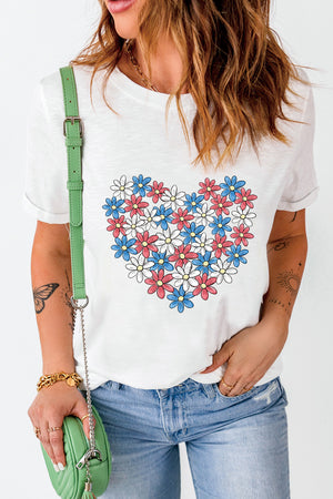 White t-shirt with a red, white, and blue floral heart graphic.