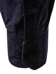 Indigo corduroy utility shirt with button cuffs and placket detail.